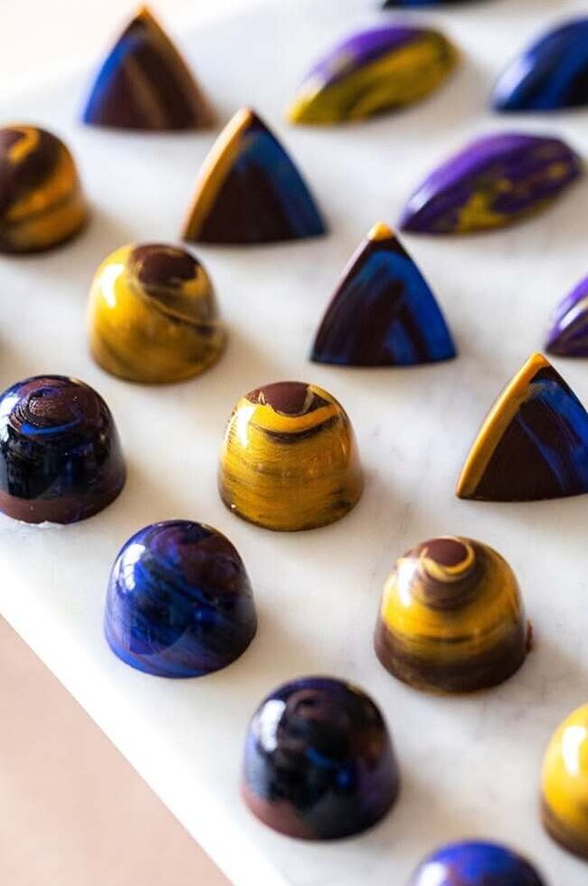 Blue and gold bonbons by Raw Xocolat