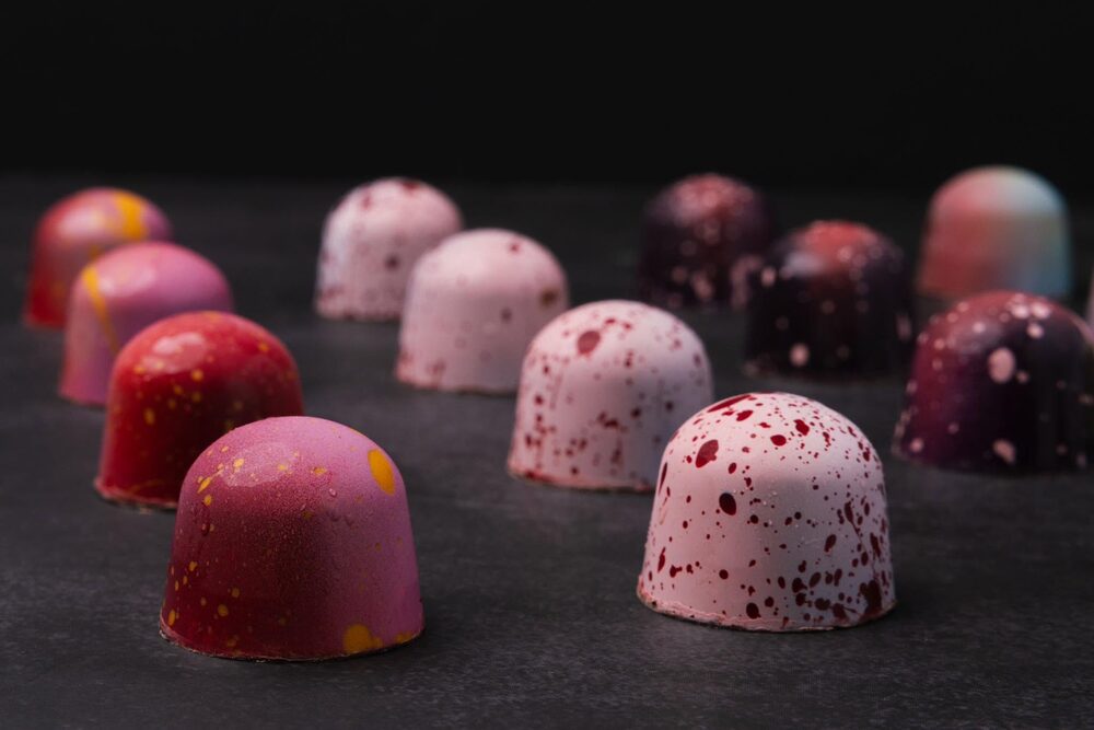 Pink and red bonbons by Raw Xocolat
